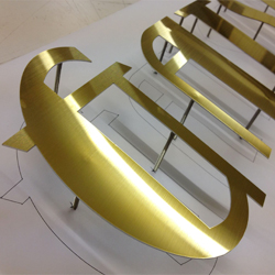 brushed gold stainless steel office sign